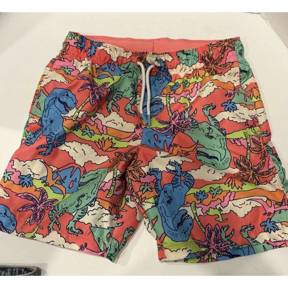 Cat & Jack boys' tropical dinosaur swim trunks feature a vibrant pink and orange